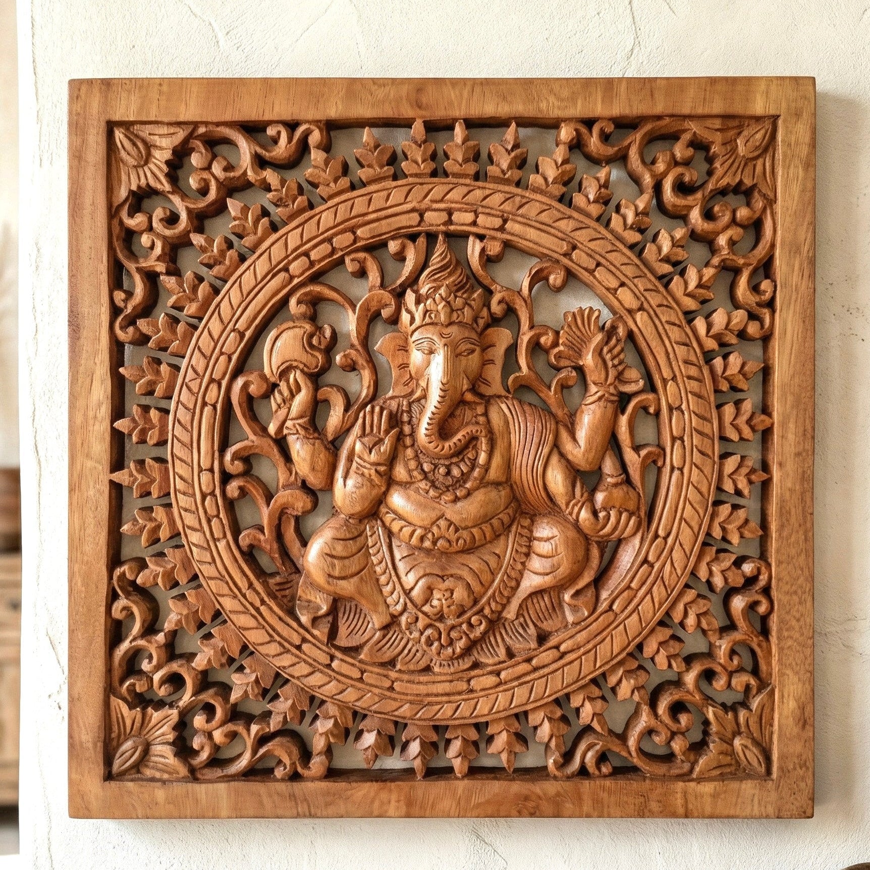Ganesh carved in suar wood – 40 × 40 cm